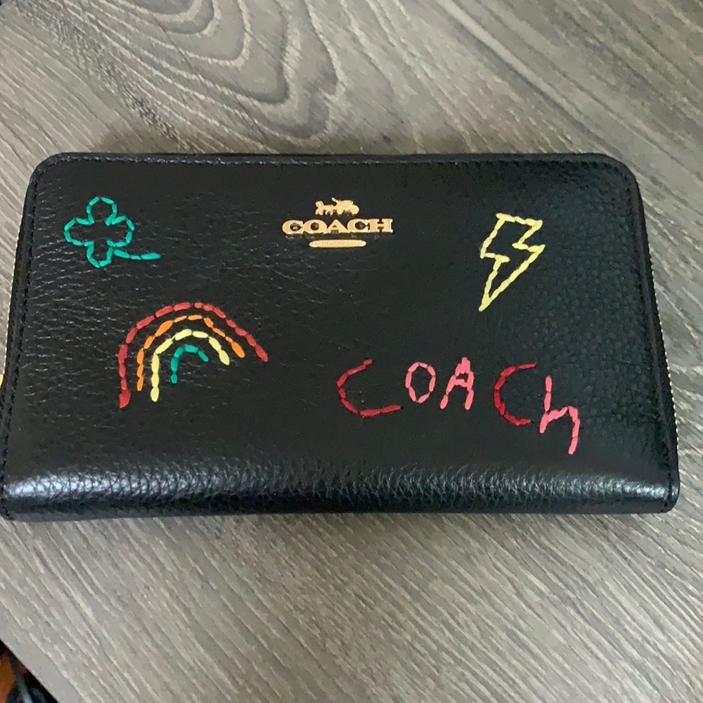 Like new Coach Pebbled Leather Wallet with stitching.